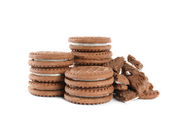 Tasty chocolate sandwich cookies with cream on white background