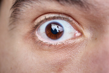 Fototapeta premium A closeup of a brown male eye, macro shot with great level of details