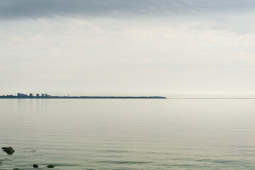 Skyline over the sea with silhouette of buildings