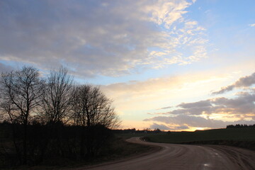 Naklejka na ściany i meble sunset over the road, beautiful sunset, beautiful evening sunset