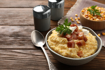 Delicious traditional Ukrainian banosh served on wooden table, space for text