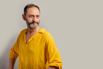 Stylish handsome grey bearded senior on casual clothes