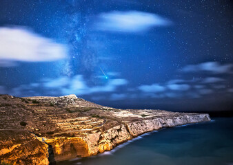 Fototapeta na wymiar Meteor flare over Fomm ir-Rih Cliffs