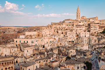 View of the Sassi di Matera from the Belvedere di San Pietro Barisano, blue sky with clouds