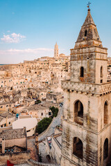 Fototapeta premium Sassi di Matera from the Belvedere di San Pietro Barisano, blue sky with clouds, vertical