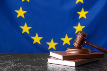 Gavel of judge with books against European Union flag