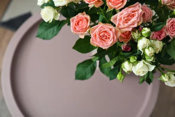  Bouquet of beautiful fresh roses on table in room, closeup © Pixel-Shot