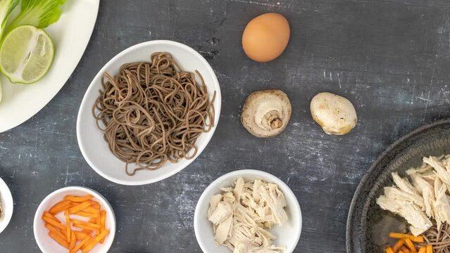 Panning over the Ingredients to Make a Bowl of Soba Noodles