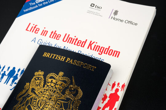 British Passport and offical test book LIFE IN THE UNITED KINGDOM which is required for Indefinite Leave to Remain and UK Citizenship. Stafford, United Kingdom, January 30, 2022.