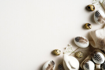 Minimal Easter concept. Easter eggs decorated feathers with cloth, bunny rabbit and gypsophila...