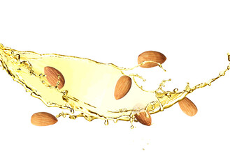 Organic almond oil and tasty nuts flying on white background