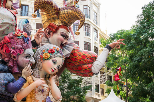 Valencia, Spain - 4 September 2021: Colorful large paper mache figuines with baroque style and joker for the national festival Fallas at 'Carrer del Comte d'Altea'