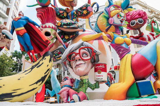 Valencia, Spain - 4 September 2021: Seventies themed paper mache figurines with Warhol, Superman and Flower Power for the national festival Fallas