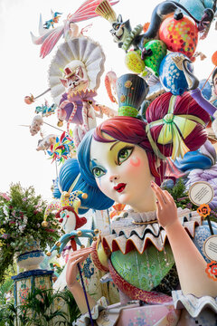 Valencia, Spain - 4 September 2021: Large paper mache display of girl holding baloons with the topic 'extravagance' for the national festival Fallas, which made the 3rd place in the years competition