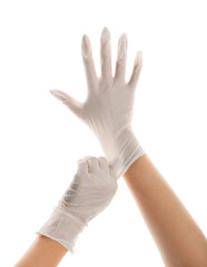 Woman wearing medical gloves on white background