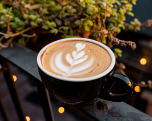 Hot coffee latte art with one cup left over