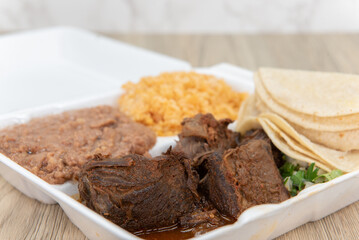 Hearty take out order of birria stew meat served to make tacos with the included tortillas, rice...