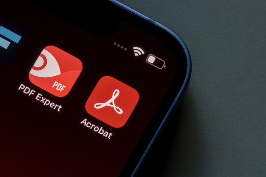 Portland, OR, USA - Feb 1, 2022: PDF Expert by Readdle and Adobe Acrobat Reader app icons are seen on an iPhone.