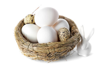 Nest with different Easter eggs and bunny on white background