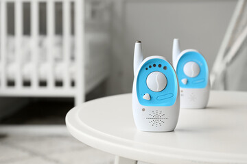Fototapeta na wymiar Modern baby monitors on table in children's room