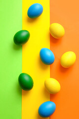 Multicolored Easter eggs on color background