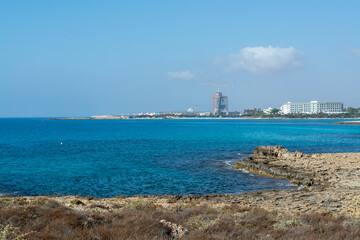 Fototapeta na wymiar Crystal clear blue water of Mediterranean sea on Nissi beach in Ayia Napa, Cyprus