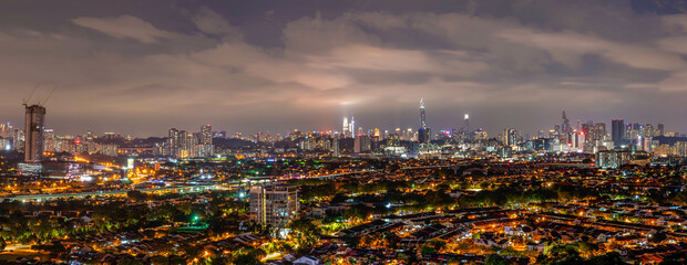 Panoramic view of city at dusk, Kuala Lumpur - obrazy, fototapety, plakaty