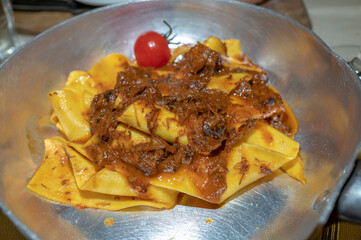 Italian pasta food, homemade pappardelle with wild boar ragu