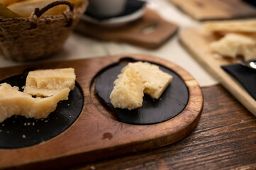 Tasting of different matured and old parmesan Parmigiano-Reggiano hard cheese in Parma, Emilia Romagna, Italy