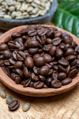 Green un-roasted and brown roasted coffee beans from Africa coffee producing region, cultivating in Ethiopia, Ivory Coast, Uganda, Kenya, Rwanda and Tanzania