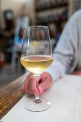 Dinner with sweet cold muscat white desert wine in traditional Italian osteria restaurant