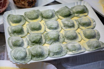 Italian food, fresh home made stuffed pasta tortelli or ravioli dumplings ready to cook, Parma, Emilia Romagna, Italy