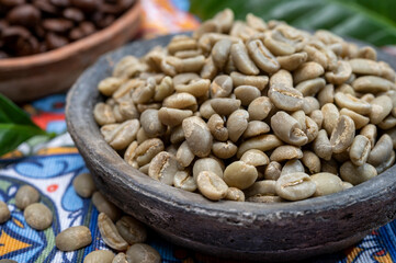 Green and roasted coffee beans from South America coffee producing region, from Colombia and Brazil with  mountain ranges and climate ideal for coffee growing