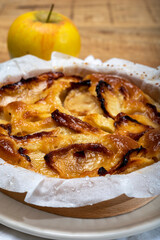 Baked apple cake with almond frangipani custard close up