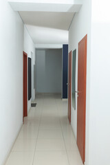 Modern empty office corridor with white walls