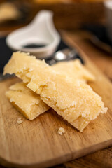 Tasting of different matured and old parmesan Parmigiano-Reggiano hard cheese in Parma, Emilia Romagna, Italy