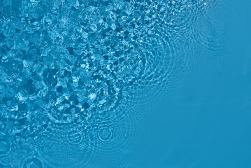 Shining blue water ripple background. Summer concept.