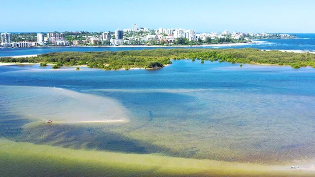 Golden Beach, Australia - 14 December 2021: Aerial view of kitesurfing on a hydrofoil board, Golden Beach, Caloundra, Sunshine Coast, Queensland, Australia.