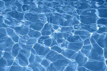 Water surface and water surface on the pool Reflecting natural blue waves on the outdoor pool. for background