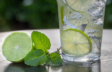 Water with Lime and Mint on Ice Close-up