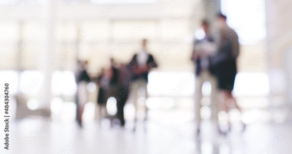 Poster coming together one business at a time. blurred businesspeople standing in a busy convention centre.
