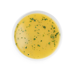 Bowl with lemon sauce on white background, top view. Delicious salad dressing