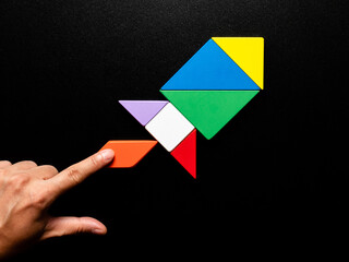 Tangram Puzzle Rocket on Black Background