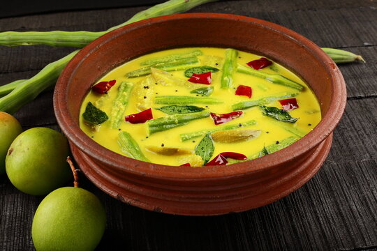 Homemade Moringa oleifera green mago curry. Kerala meals dish.