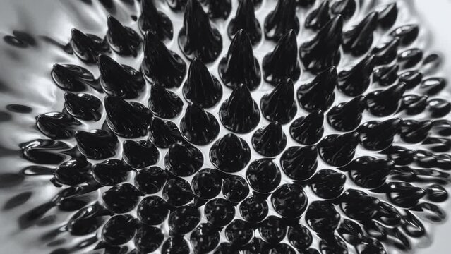 Ferrofluid. Black liquid surface. Abstract background.