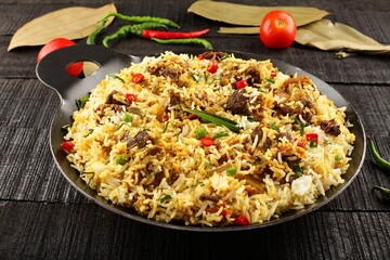 Homemade delicious Indian mutton biryani, pilaf, dum biriyani. exotic traditional recipes.