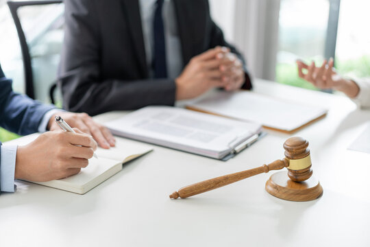 Law Concept The Businessman, A Man With The Black Suit, Having A Law Consultation With The Law Officer, A Man In Deep Blue Suit And His Assistant, A Man In White Shirt