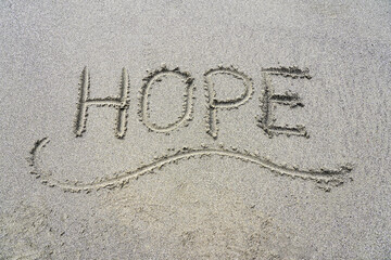Hope written in sand. Inspirational word hope in the sand of a California Beach. Word written on beach.