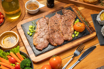 Kamui Wagyu Beef Strip Lloyd marble Steak Grill with fresh vegetaber salad, Baked Potatoes with butter