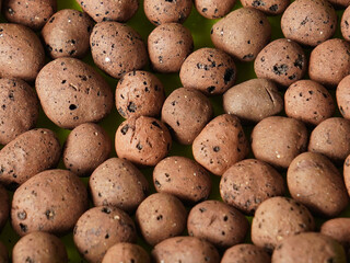 Large lightweight expanded clay aggregates (LECA) are used for growing plants without soil.